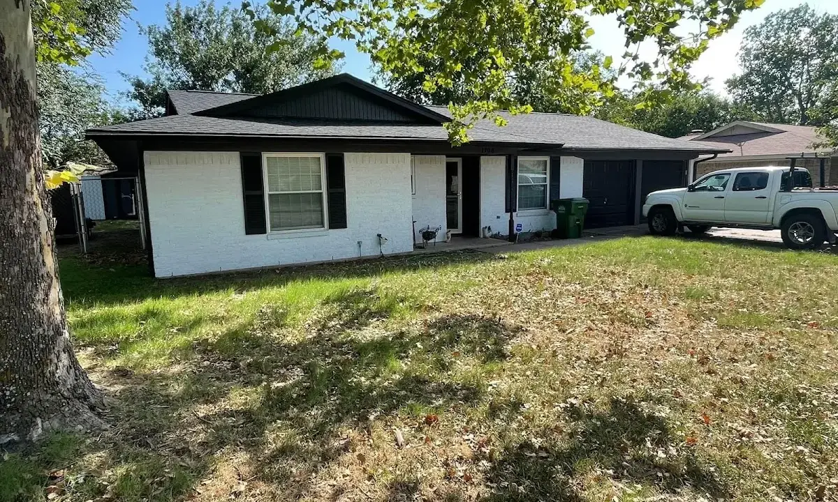 Professional roofing crew working on a residential roof in Eagan